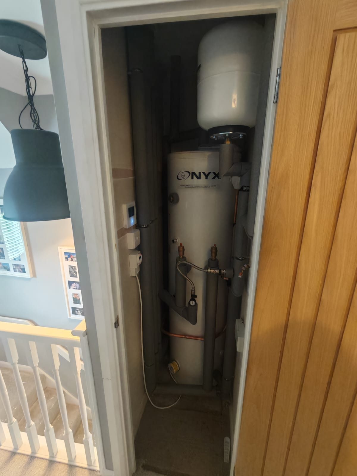 Hot water cylinder installed in an airing cupboard by FB Gas
